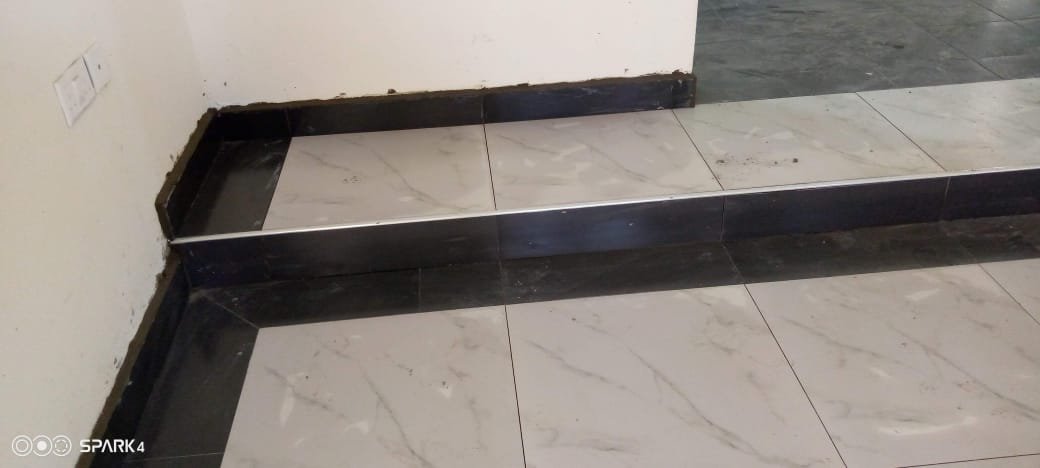Raised platform with black granite border tiling